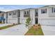 Charming townhomes with attached garages and professionally landscaped front yards at 305 Heavenly Hollow Pl, Mcdonough, GA 30253