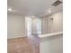 Hallway with carpeted floor and multiple doorways leading to different rooms at 305 Heavenly Hollow Pl, Mcdonough, GA 30253