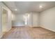 Hallway with carpet and doorway to a bathroom at 305 Heavenly Hollow Pl, Mcdonough, GA 30253