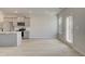 Bright kitchen with an island, stainless steel refrigerator, and access to the backyard at 305 Heavenly Hollow Pl, Mcdonough, GA 30253