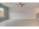 Spacious living room with light wood floors, ceiling fan, and natural light at 305 Heavenly Hollow Pl, Mcdonough, GA 30253