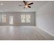 Bright, expansive living room with ample natural light and light wood floors at 305 Heavenly Hollow Pl, Mcdonough, GA 30253
