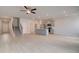 Open floor plan with staircase, modern kitchen, and light-colored flooring at 305 Heavenly Hollow Pl, Mcdonough, GA 30253