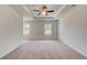 Spacious main bedroom with trey ceiling, carpet, and natural light from two windows at 305 Heavenly Hollow Pl, Mcdonough, GA 30253