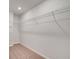 Walk-in closet with carpet floors, white walls, and wire shelving for ample storage at 305 Heavenly Hollow Pl, Mcdonough, GA 30253