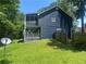 Lush backyard with a spacious deck and screened porch, ideal for entertaining at 4790 Brandon Acres Ln, Buford, GA 30519