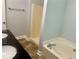 This bathroom features a tub and shower combination with double sinks at 4790 Brandon Acres Ln, Buford, GA 30519