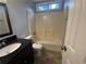 Cozy bathroom featuring tile floors, granite vanity and a tub with shower combo at 4790 Brandon Acres Ln, Buford, GA 30519