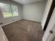Comfortable bedroom with plush carpeting and bright window at 4790 Brandon Acres Ln, Buford, GA 30519
