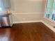 Sun-drenched dining area with hardwood floors and access to the kitchen at 4790 Brandon Acres Ln, Buford, GA 30519