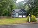 Charming two-story home with blue siding, white trim, and a well-manicured lawn at 4790 Brandon Acres Ln, Buford, GA 30519