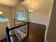 Bright foyer with hardwood floors, staircase and a view of the chandeliered dining room at 4790 Brandon Acres Ln, Buford, GA 30519