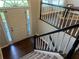 Bright foyer featuring a staircase and a door to the exterior, with natural light filling the space at 4790 Brandon Acres Ln, Buford, GA 30519