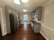Updated kitchen featuring stainless steel appliances, gray cabinets, and hardwood floors at 4790 Brandon Acres Ln, Buford, GA 30519