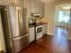 Beautiful kitchen featuring stainless steel refrigerator, stove, and ample cabinet space at 4790 Brandon Acres Ln, Buford, GA 30519