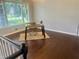 Bright office with a desk, a woven rug, and large windows offering natural light, creating a productive workspace at 4790 Brandon Acres Ln, Buford, GA 30519