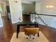 Home office space featuring a desk, chair, and a view into the living room and kitchen, blending work and home at 4790 Brandon Acres Ln, Buford, GA 30519