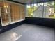 Relaxing screened-in porch perfect for enjoying the peaceful surroundings and views of the backyard at 4790 Brandon Acres Ln, Buford, GA 30519
