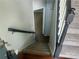 Carpeted staircase with dark wood handrail and trim at 4790 Brandon Acres Ln, Buford, GA 30519