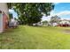 Large grassy backyard with mature trees, with plenty of room for outdoor activities at 5791 Cobbrook Dr, Ellenwood, GA 30294