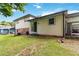Expansive yard featuring a well-maintained lawn, covered patio and a two-story home at 5791 Cobbrook Dr, Ellenwood, GA 30294