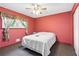 Bedroom featuring neutral colors, a ceiling fan, and a window with natural light at 5791 Cobbrook Dr, Ellenwood, GA 30294