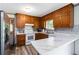 Kitchen featuring custom wood cabinets, marble countertops and stainless steel appliances at 5791 Cobbrook Dr, Ellenwood, GA 30294
