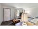 Bright living room with neutral walls, carpeted floor, and abundant natural light at 5791 Cobbrook Dr, Ellenwood, GA 30294