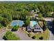 Aerial view of community amenities featuring a tennis court, clubhouse, swimming pool, playground, and lush greenery at 1265 Timberline Pl, Alpharetta, GA 30005