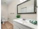 Cozy bathroom with a white vanity, decorative mirror and neutral colors providing a clean and inviting space at 1265 Timberline Pl, Alpharetta, GA 30005