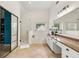 Well-lit bathroom with large vanity, granite counters, glass shower, and soaking tub at 1265 Timberline Pl, Alpharetta, GA 30005
