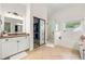 Bathroom featuring a large vanity, glass shower, soaking tub and tile floors at 1265 Timberline Pl, Alpharetta, GA 30005