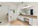 Bright bathroom featuring a glass shower, a soaking tub, and large vanity at 1265 Timberline Pl, Alpharetta, GA 30005