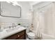 Bright bathroom with a vanity, stylish mirror, and bathtub with shower at 1265 Timberline Pl, Alpharetta, GA 30005