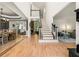Bright foyer with hardwood floors, staircase, and views of the living room and dining room providing an open concept at 1265 Timberline Pl, Alpharetta, GA 30005