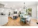 Modern kitchen with white cabinets, stainless steel appliances, kitchen island and an adjacent dining area at 1265 Timberline Pl, Alpharetta, GA 30005