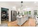 Well-lit kitchen with stainless steel appliances, white cabinets, and a view to the backyard at 1265 Timberline Pl, Alpharetta, GA 30005