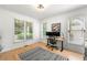 Bright home office with natural light, hardwood floors, and a modern desk setup at 1265 Timberline Pl, Alpharetta, GA 30005