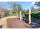 Neighborhood playground featuring multiple swingsets and lush trees creating a fun, community space at 1265 Timberline Pl, Alpharetta, GA 30005