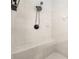 Modern shower with updated shower head, white tile walls, and tiled seat at 1265 Timberline Pl, Alpharetta, GA 30005