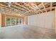 Large unfinished basement space with exposed framework and concrete floors, featuring natural lighting at 2585 Hickory Rd, Canton, GA 30115
