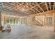 Unfinished basement with exposed beams, concrete floors, stairs, and natural light at 2585 Hickory Rd, Canton, GA 30115
