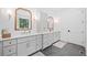 Bathroom features double vanity with marble countertop, gold fixtures and view to nature at 2585 Hickory Rd, Canton, GA 30115