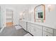 Bathroom features double vanity with marble countertop, gold fixtures and view to nature at 2585 Hickory Rd, Canton, GA 30115