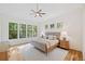 Beautifully lit bedroom with neutral tones, large windows, and hardwood floors at 2585 Hickory Rd, Canton, GA 30115