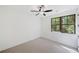 Bedroom features carpet flooring, a ceiling fan, and a wooded view at 2585 Hickory Rd, Canton, GA 30115