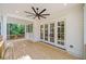Covered deck featuring wood flooring, fan, white columns, wood railing and access to the yard at 2585 Hickory Rd, Canton, GA 30115