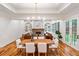 Open-concept dining room with views of the living room and access to the backyard at 2585 Hickory Rd, Canton, GA 30115
