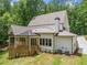 Home exterior with deck, patio, lush lawn and landscaping at 2585 Hickory Rd, Canton, GA 30115
