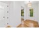 Hallway with hardwood floors and doors leading to the bathroom and other rooms at 2585 Hickory Rd, Canton, GA 30115